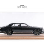 Black Bentley sedan model car in a tabletop display case