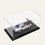 Silver No. 14 race car model in a black tabletop display case