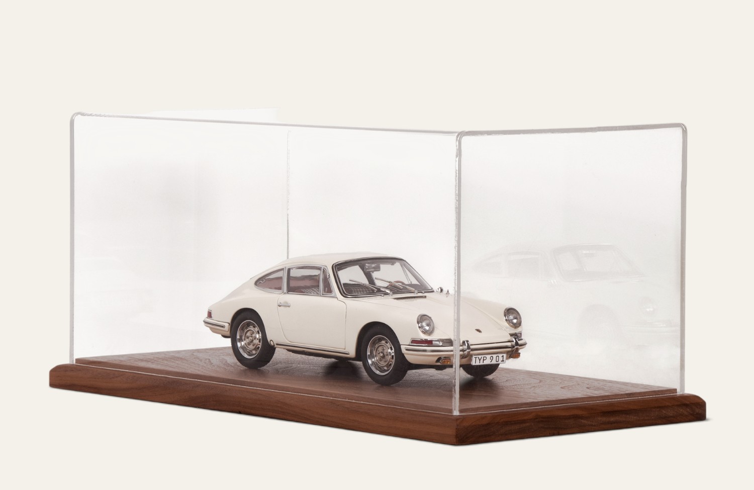 Walnut tabletop display case with a white vintage Porsche model car