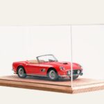 Oak tabletop display case with a red Ferrari California model car